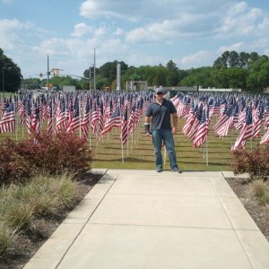 Me standing in front of field of American Flags