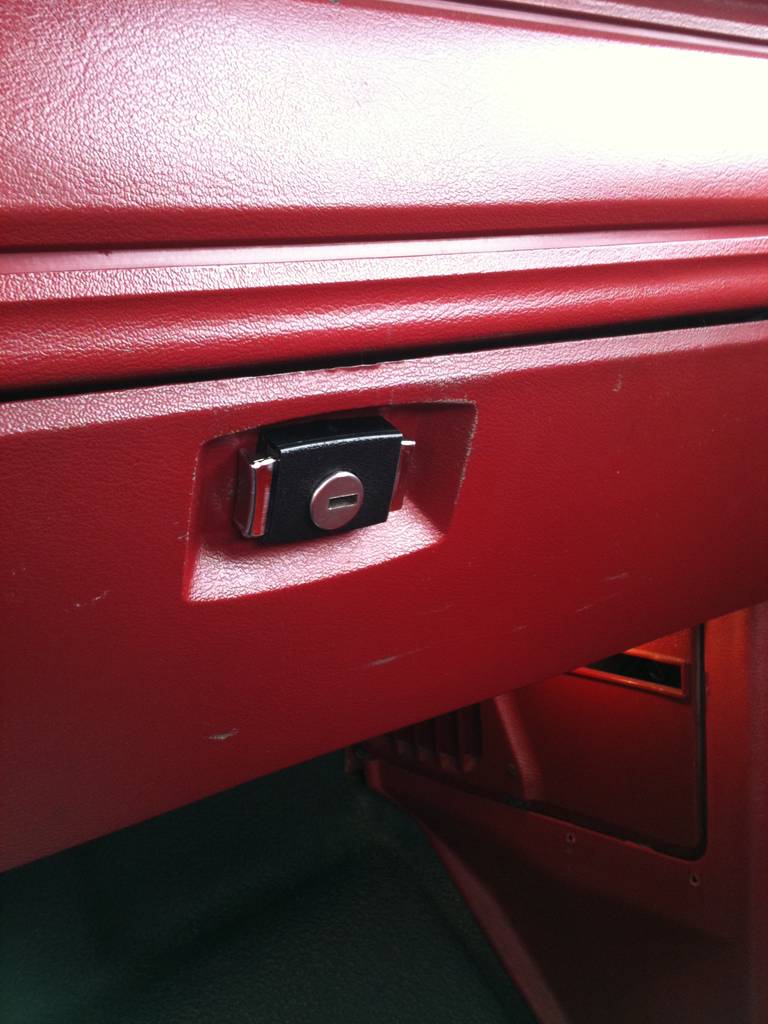 locking glove box latch with chrome tabs