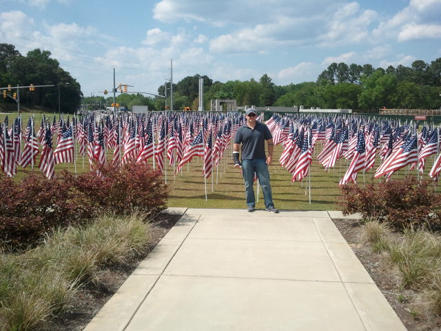 Me standing in front of field of American Flags