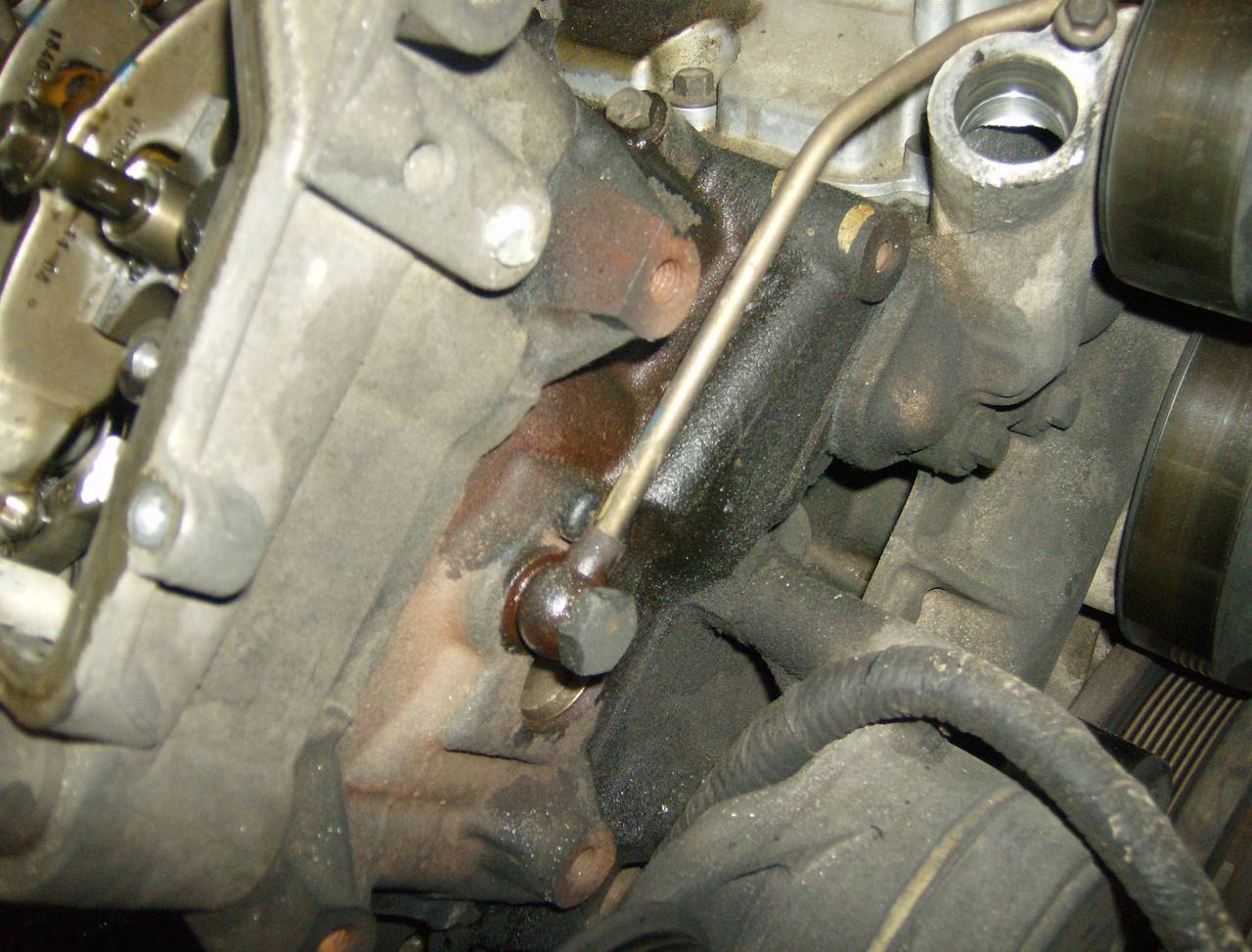 remove fuel line from front of heads